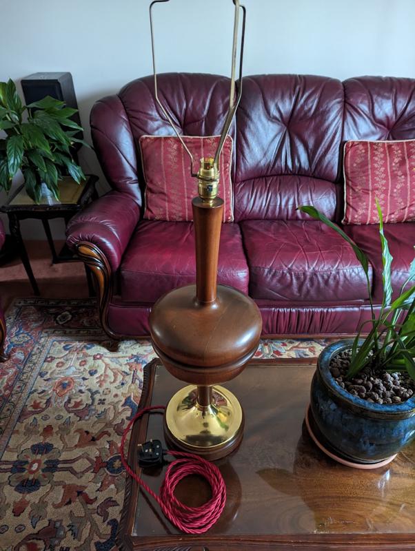 The unit was taken apart and the hole for the cable was drilled out to accept a three-core replica vintage cable. The brass plate had an earth cable soldered to it on the inside and then the outside was polished. All the wood was cleaned and hand-made bees wax applied then polished.